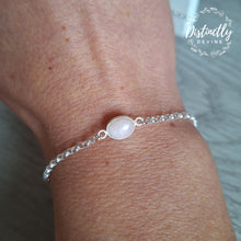 Load image into Gallery viewer, Rose Quartz is the stone of universal love, feminine energy, healing, compassion and peace. It is a beautiful stone and sits perfectly in this oval silver setting.